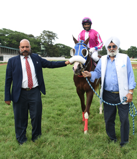 Trust Bond (Kiran Rai P up), winner of the DR.N.M.Srinivas Memorial Trophy, being led in by trainer Pratap Kamath M on Wednesday races at Mysore.